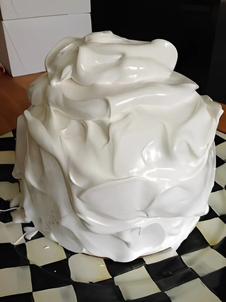 Fluffy white cake with glossy icing