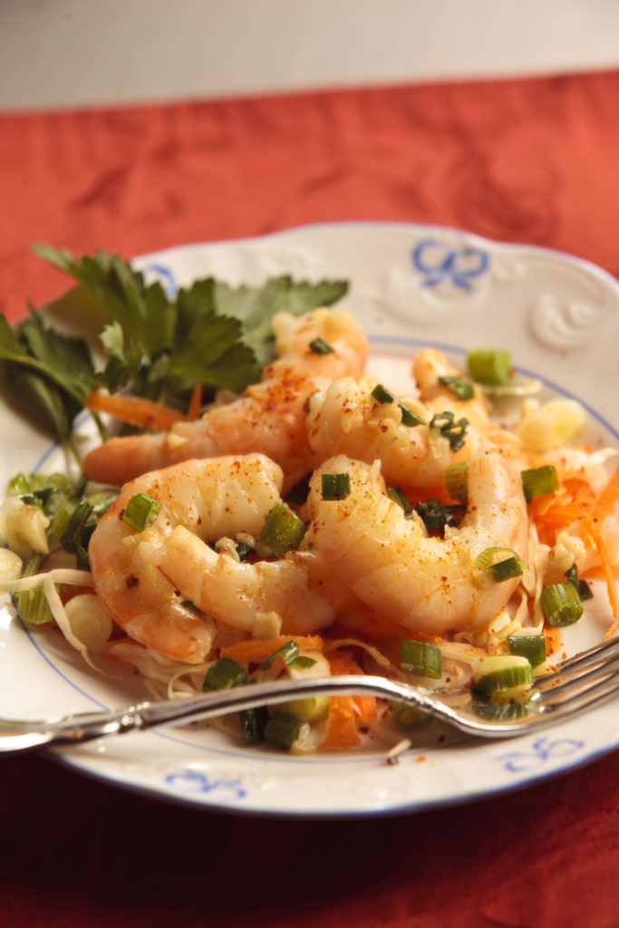 Shrimp salad with greens and vegetables.