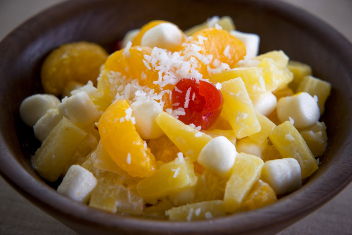 Fruit salad with marshmallows and shredded coconut.