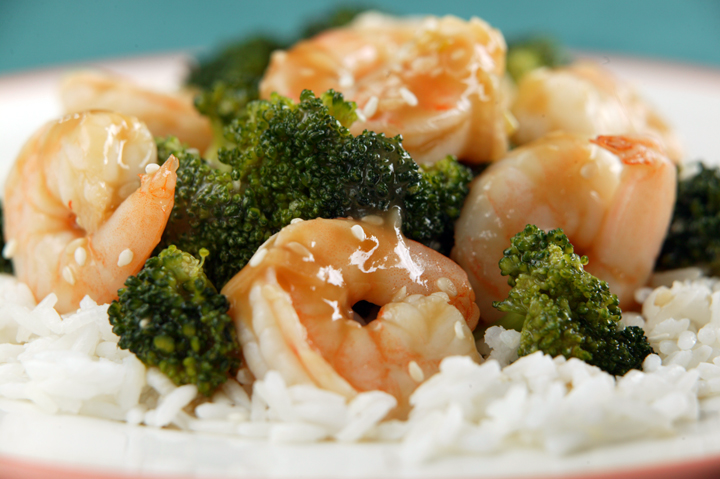 Shrimp and broccoli on rice dish.