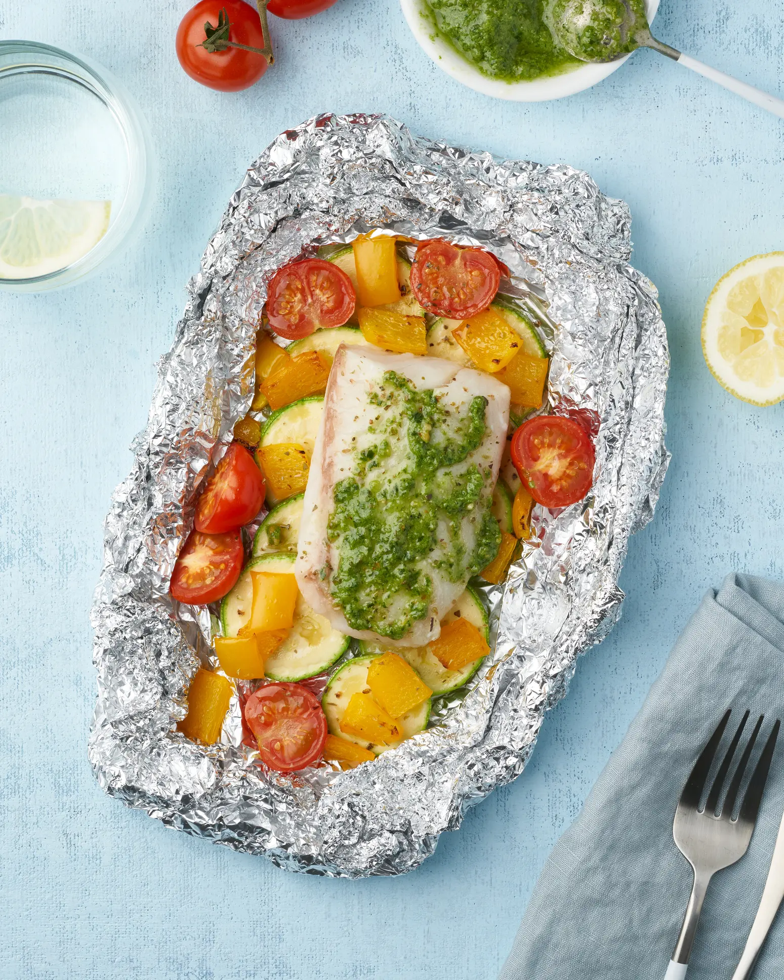Baked fish with vegetables in foil.